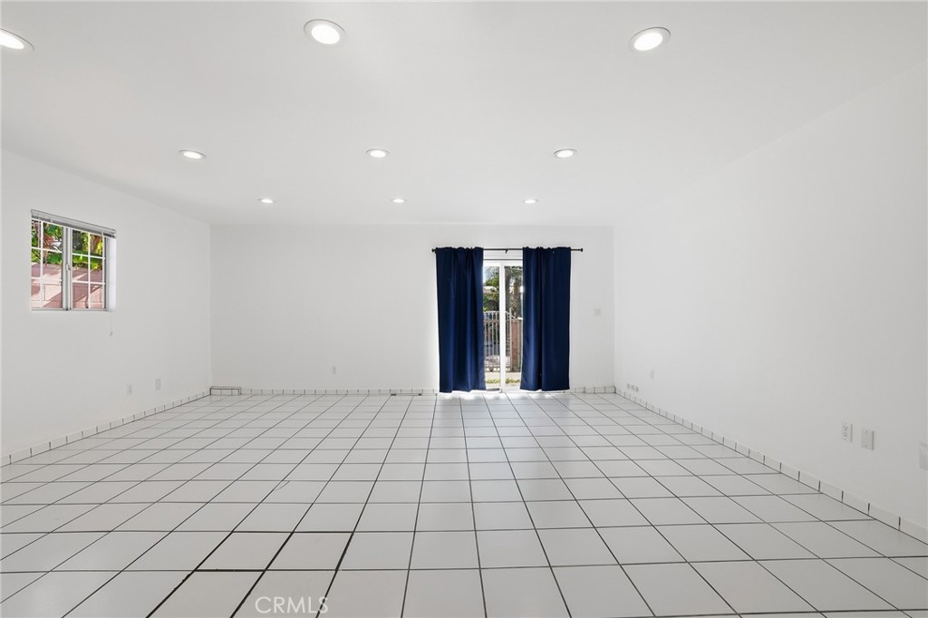 12755 Judd Street Pacoima, CA 91331 - Photo 12 of 46 an empty room with natural light and window
