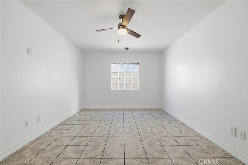 12755 Judd Street Pacoima, CA 91331 - Photo 24 of 46 wooden floor in an empty room with a window