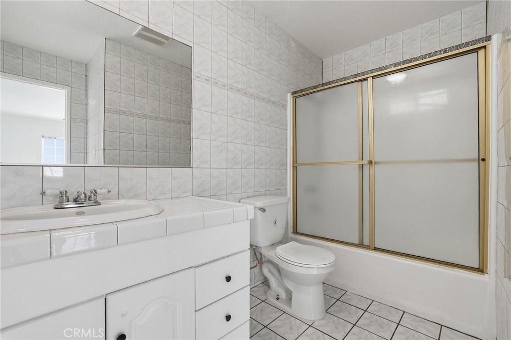 12755 Judd Street Pacoima, CA 91331 - Photo 27 of 46 a bathroom with a sink toilet and shower