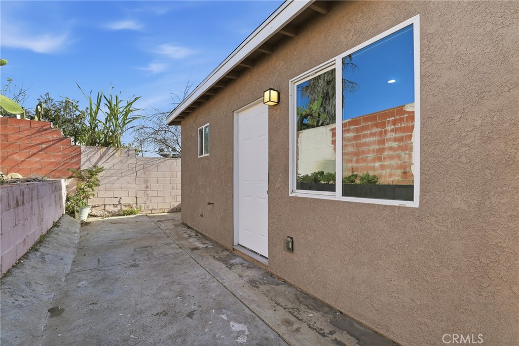 12755 Judd Street Pacoima, CA 91331 - Photo 30 of 46 a view of a house with a yard and potted plants