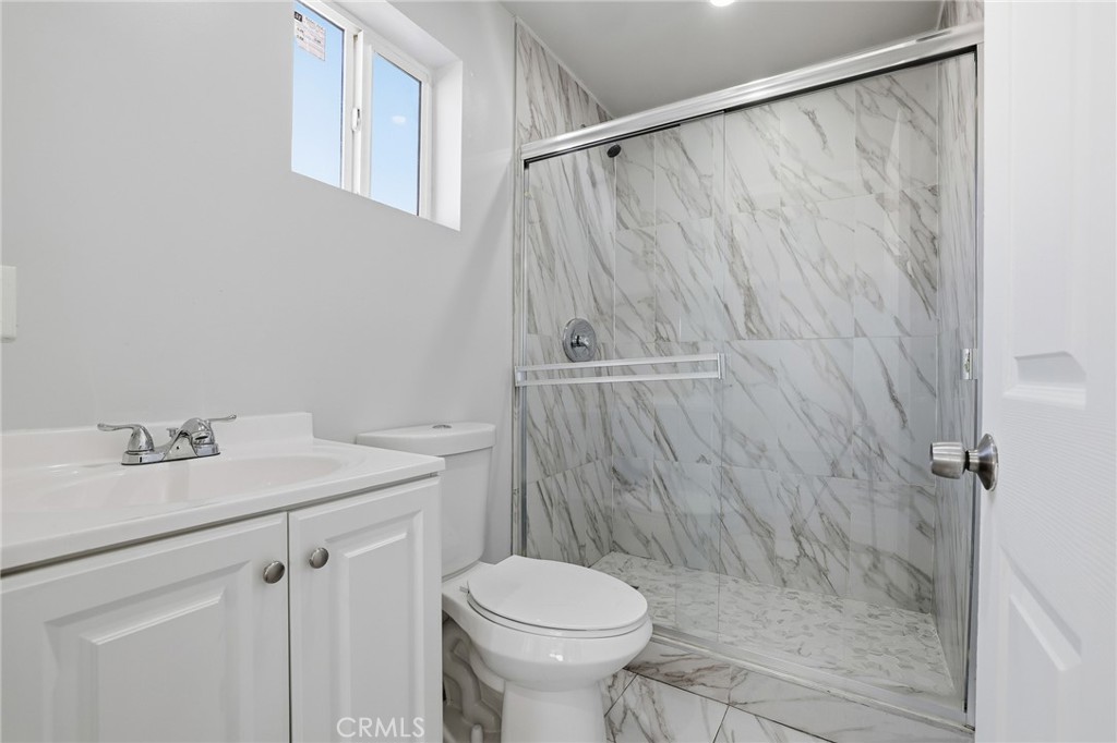 12755 Judd Street Pacoima, CA 91331 - Photo 35 of 46 a bathroom with a sink a toilet and shower