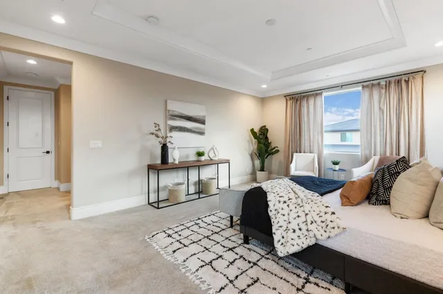 a spacious bathroom with a double vanity sink large mirror and a bathtub