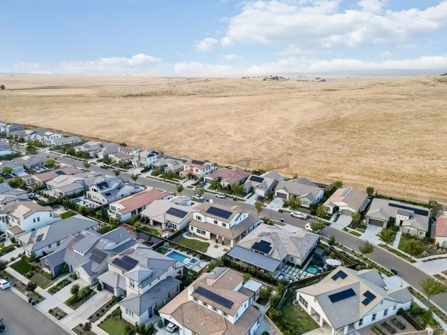 a view of a building with potted plants