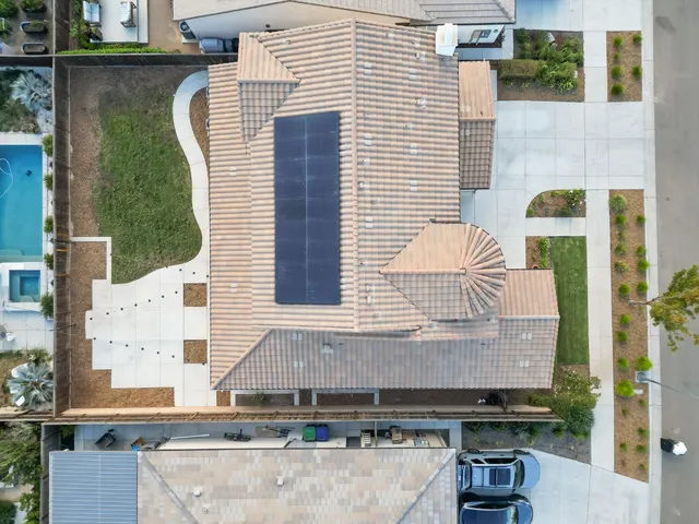 a view of a patio with table and chairs with wooden floor and fence