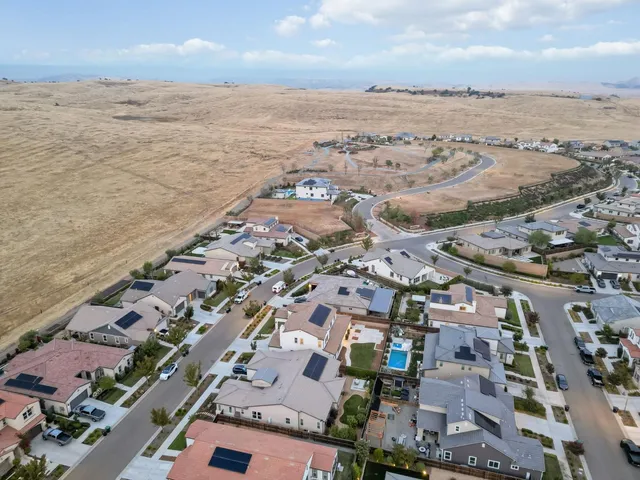 a view of a chairs and table in the patio
