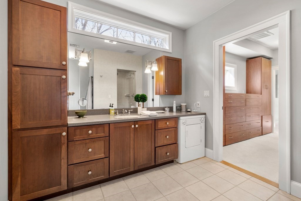 11 Wenham Road Newton, MA 02461 - Photo 13 of 19 a bathroom with a double vanity sink and mirror