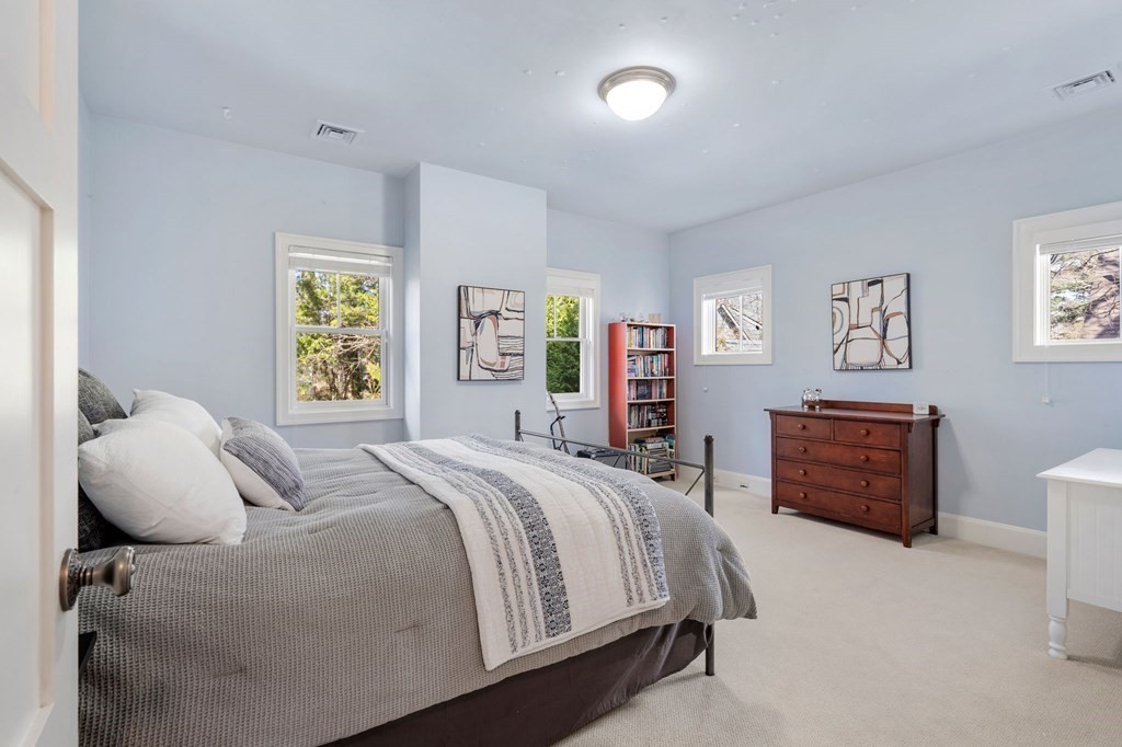 11 Wenham Road Newton, MA 02461 - Photo 15 of 19 a bedroom with a bed and a dresser