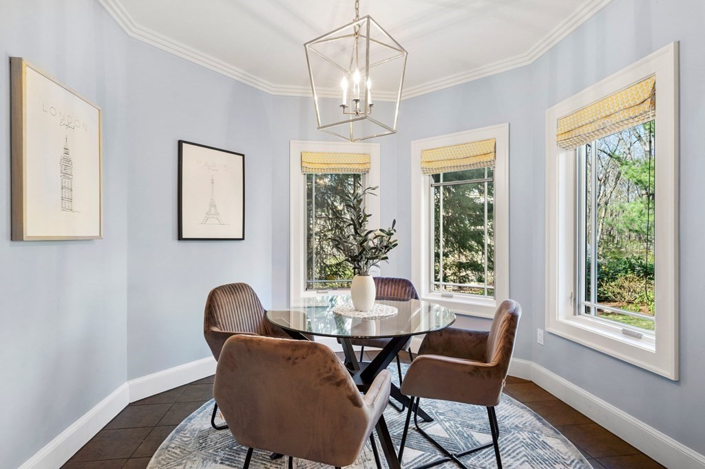 11 Wenham Road Newton, MA 02461 - Photo 5 of 19 a dining room with furniture a chandelier and wooden floor