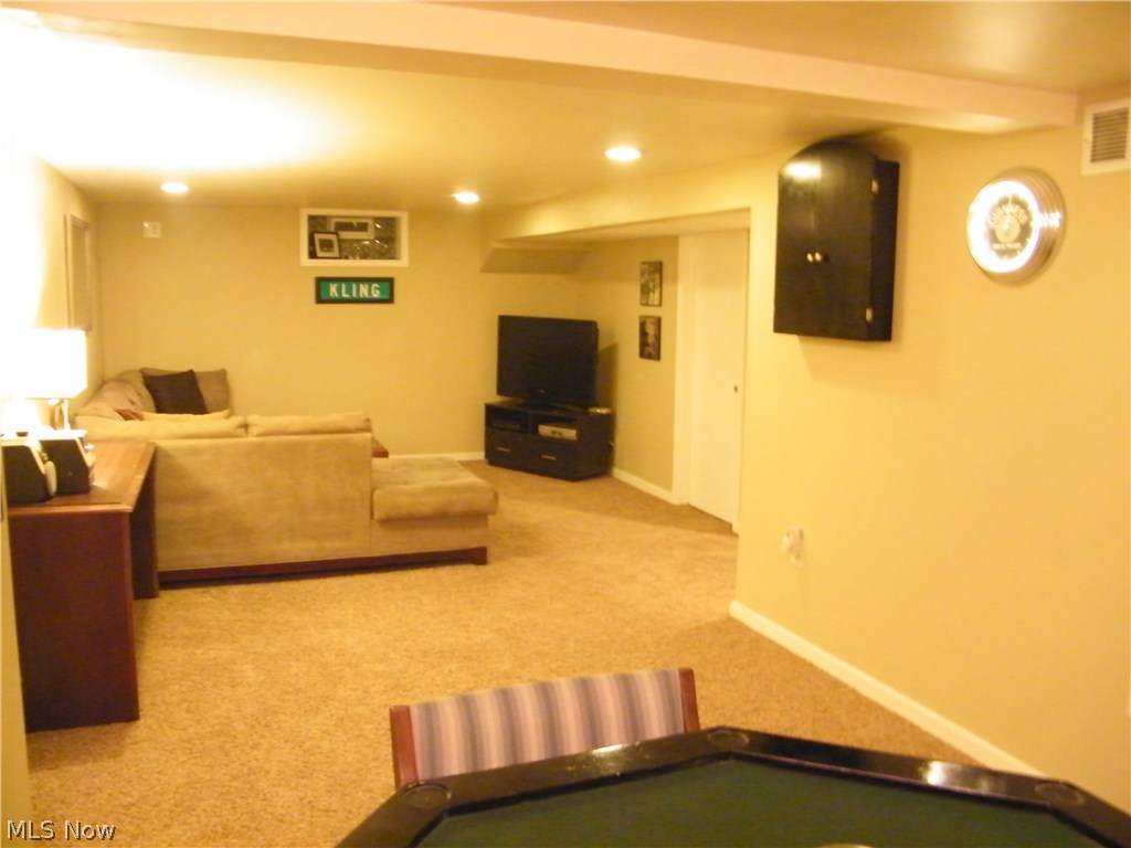 734 Ranney Street Akron, OH 44310 - Photo 5 of 31 Finished basement with recreation area and office or fourth bedroom.