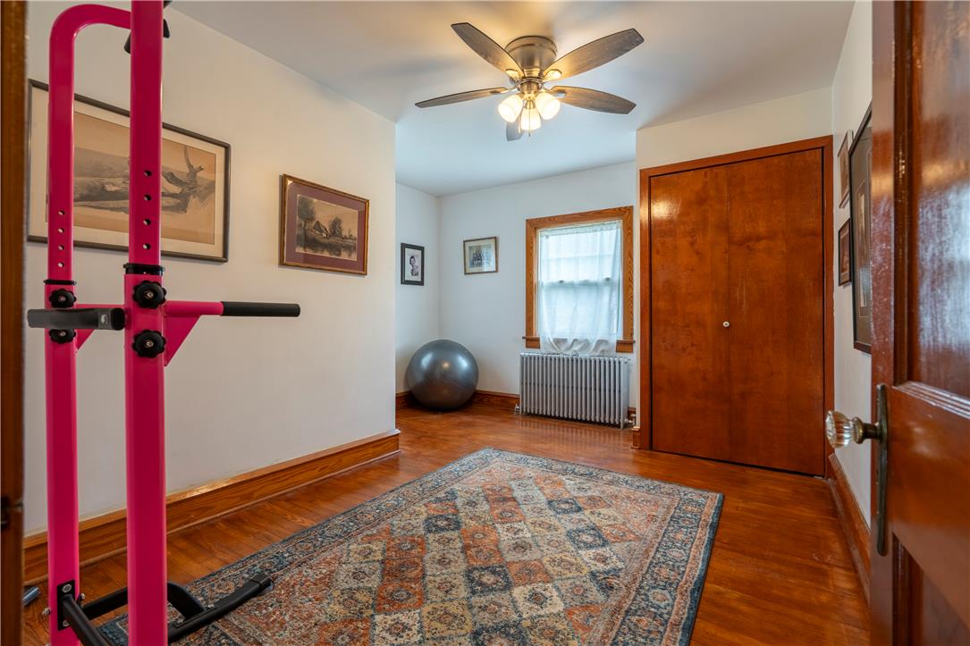 665 Point Phillips Road Bath, PA 18014 - Photo 26 of 73 A versatile bonus room features rich hardwood flooring and a warm ceiling fan light fixture.