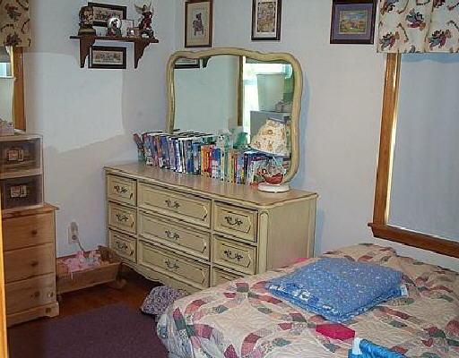 2117 Byrd Road Elliston, VA 24087 - Photo 4 of 6 a bedroom with a bed and a dresser