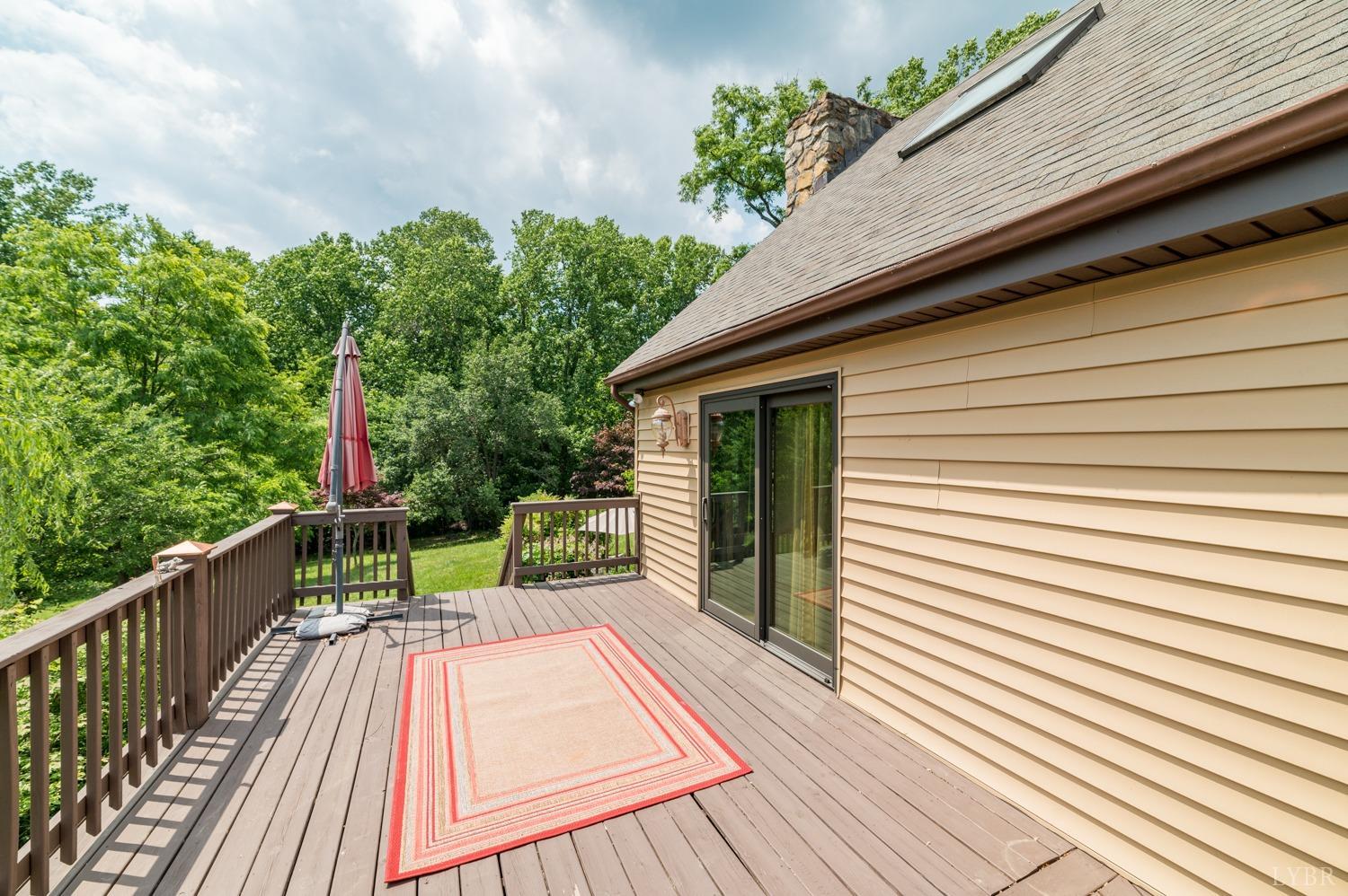 1796 Union Church Road Thaxton, VA 24174 - Photo 32 of 83 a view of deck with a table and chairs and wooden floor