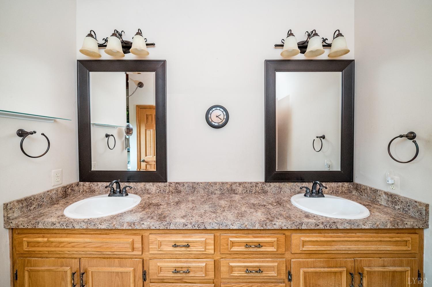 1796 Union Church Road Thaxton, VA 24174 - Photo 50 of 83 a bathroom with a granite countertop sink and a mirror