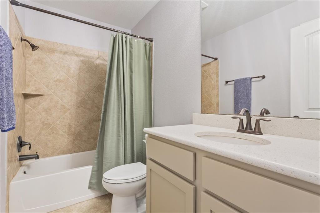 101 Rancho Lorena Drive Lorena, TX 76655 - Photo 30 of 40 a bathroom with a sink toilet and shower