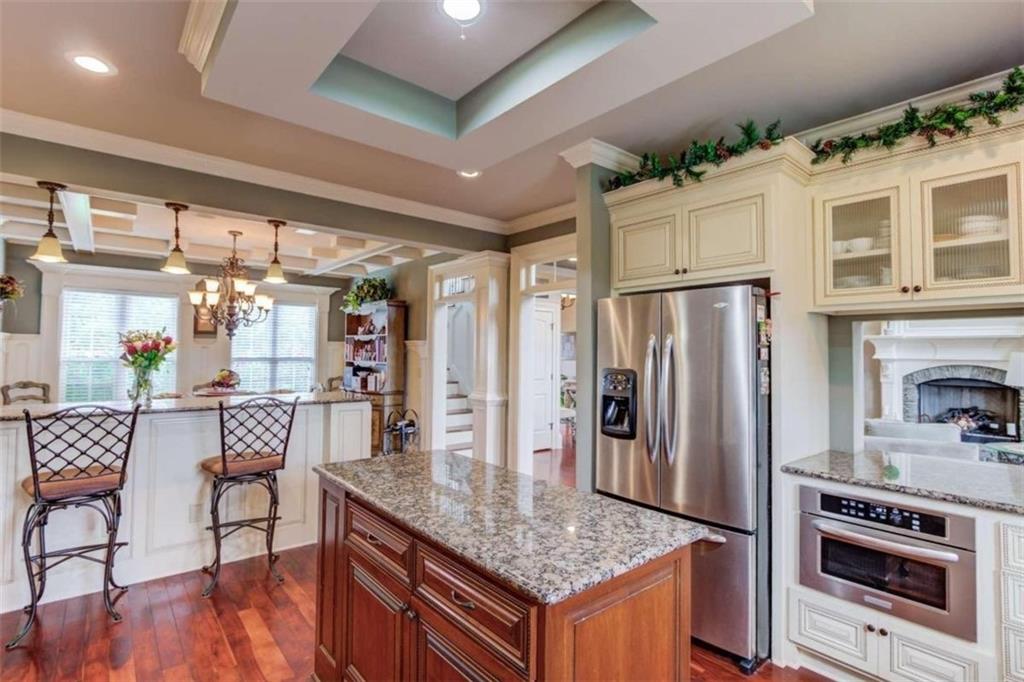 2008 Costley Mill Road Northeast Conyers, GA 30013 - Photo 12 of 55 a kitchen with stainless steel appliances granite countertop a refrigerator and a stove