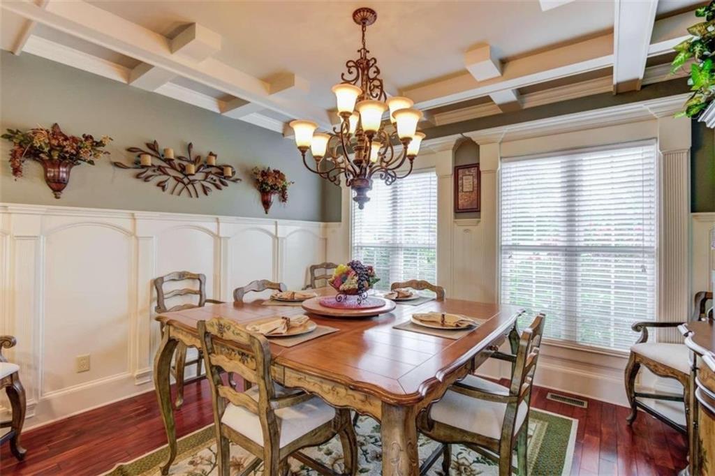 2008 Costley Mill Road Northeast Conyers, GA 30013 - Photo 13 of 55 a view of a dining room with furniture wooden floor and chandelier