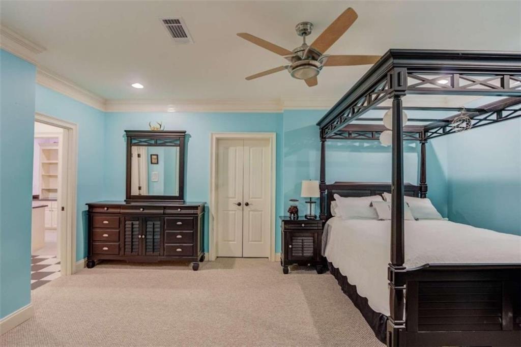 2008 Costley Mill Road Northeast Conyers, GA 30013 - Photo 32 of 55 a bedroom with a bed and a chandelier