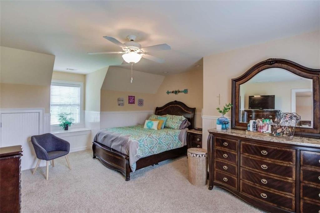2008 Costley Mill Road Northeast Conyers, GA 30013 - Photo 39 of 55 a bedroom with a bed dresser and a window