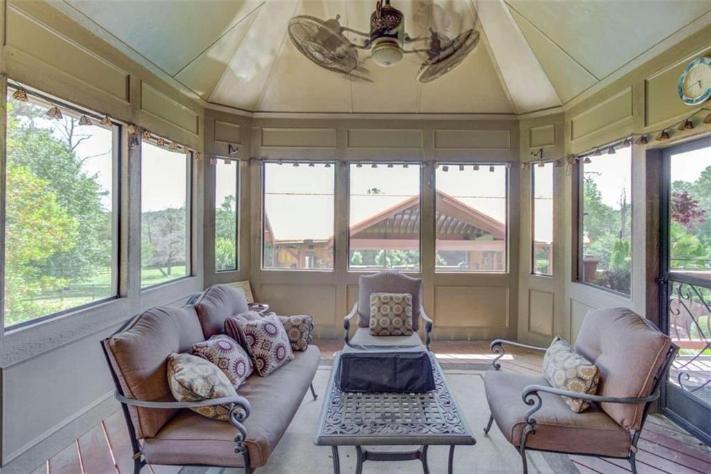 2008 Costley Mill Road Northeast Conyers, GA 30013 - Photo 43 of 55 a living room with furniture and a floor to ceiling window