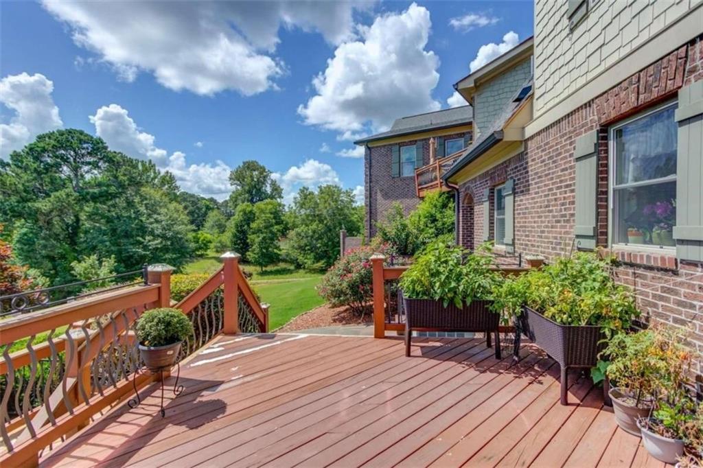 2008 Costley Mill Road Northeast Conyers, GA 30013 - Photo 44 of 55 a view of a house with backyard and sitting area