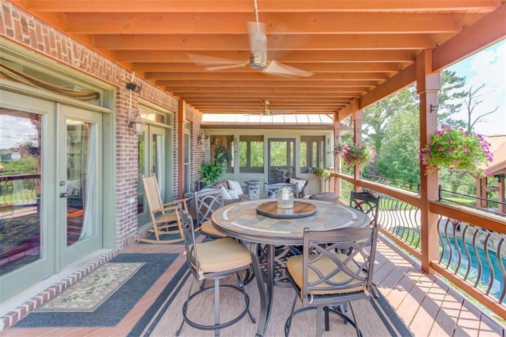 2008 Costley Mill Road Northeast Conyers, GA 30013 - Photo 45 of 55 a view of a patio with table and chairs and potted plants