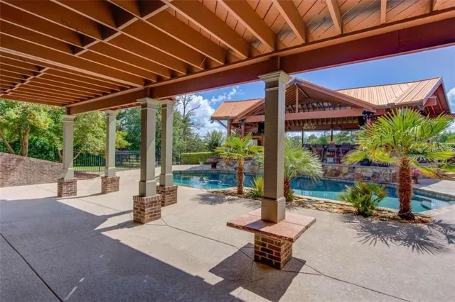 a view of a swimming pool with a patio