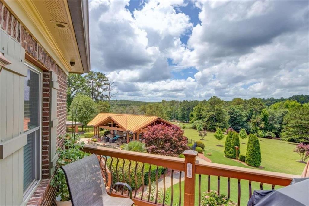 2008 Costley Mill Road Northeast Conyers, GA 30013 - Photo 47 of 55 a view of a balcony with wooden fence