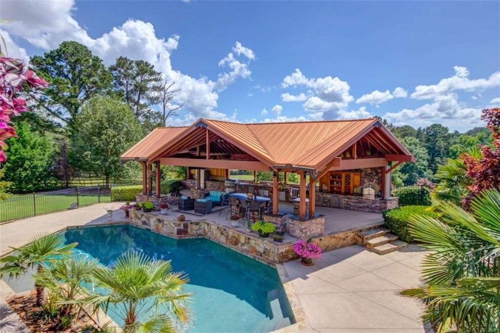 2008 Costley Mill Road Northeast Conyers, GA 30013 - Photo 48 of 55 a view of swimming pool with outdoor seating and a patio
