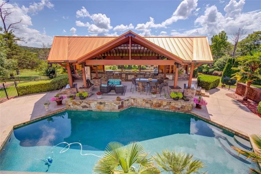 2008 Costley Mill Road Northeast Conyers, GA 30013 - Photo 49 of 55 a view of a swimming pool with a patio