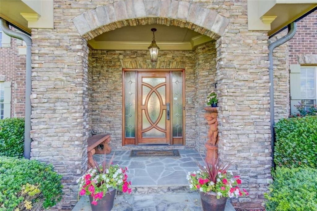 2008 Costley Mill Road Northeast Conyers, GA 30013 - Photo 5 of 55 a front view of a house with a garden