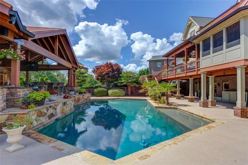 2008 Costley Mill Road Northeast Conyers, GA 30013 - Photo 51 of 55 a view of a house with backyard porch and sitting area