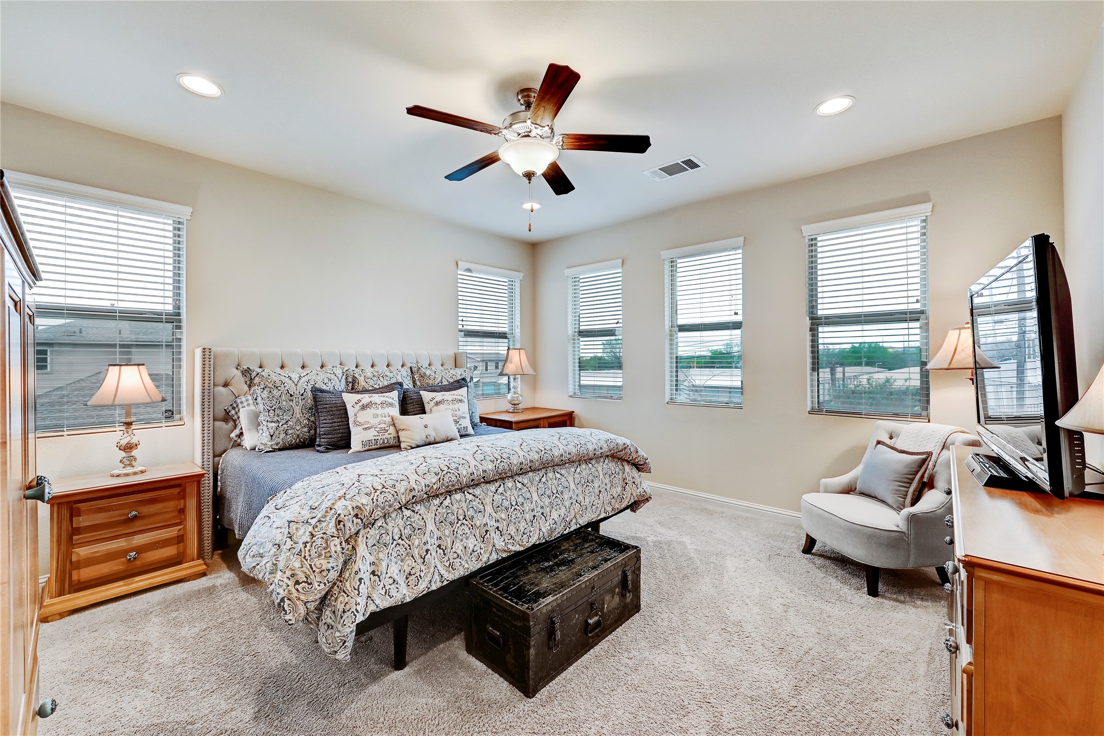 6814 East Riverside Drive, Unit 64 Austin, TX 78741 - Photo 10 of 17 Primary Bedroom is located on the second floor. Well-lit bedroom offers plush carpeting and a classic ceiling fan for ultimate comfort.