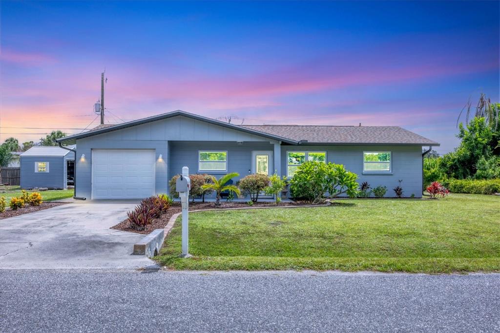 4521 Rainbow Road Venice, FL 34293 - Photo 1 of 1 a view of a house with backyard and garden