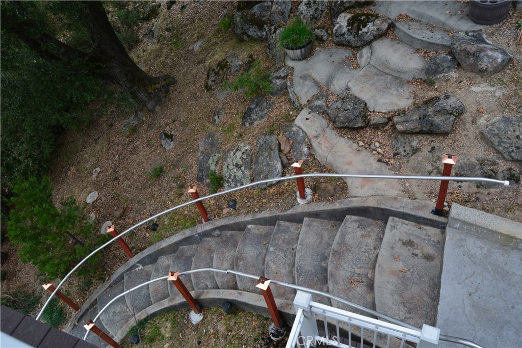 39818 Granite Ridge Lane Bass Lake, CA 93604 - Photo 14 of 29 a view of a balcony with a yard