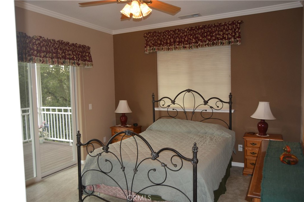 39818 Granite Ridge Lane Bass Lake, CA 93604 - Photo 15 of 29 a bedroom with a bed and a window