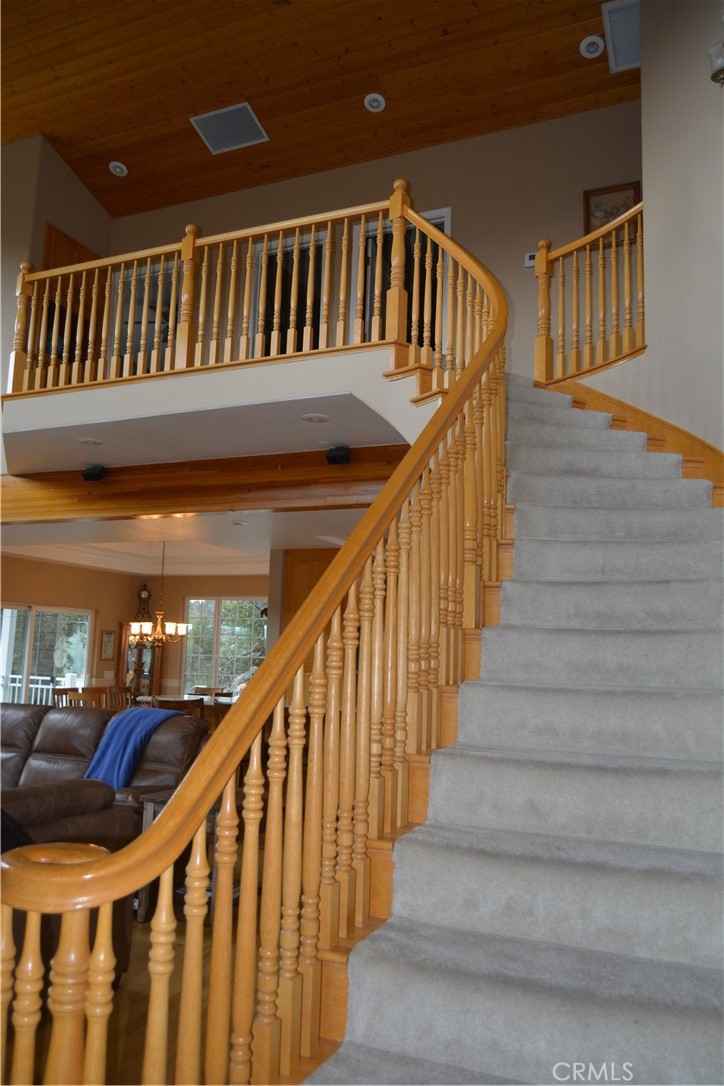 39818 Granite Ridge Lane Bass Lake, CA 93604 - Photo 20 of 29 a view of staircase with railing and white walls