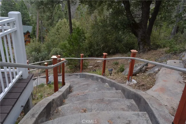 a view of a roof deck with wooden fence