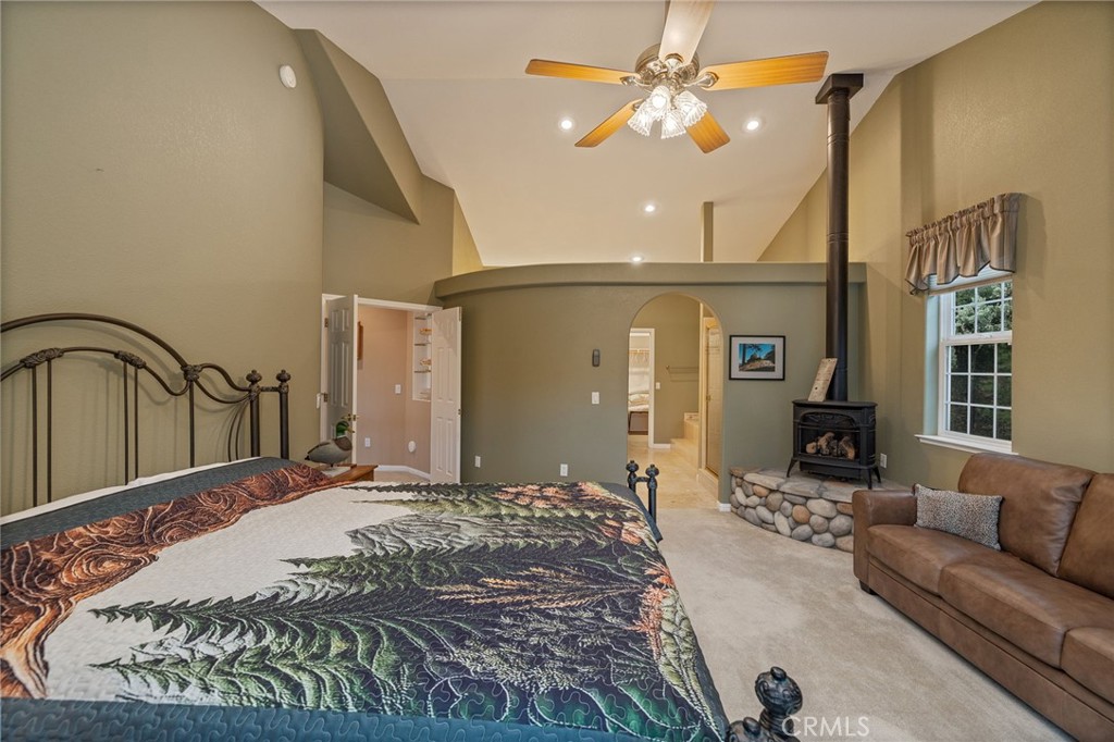 39818 Granite Ridge Lane Bass Lake, CA 93604 - Photo 24 of 58 primary suite with propane fueled fireplace