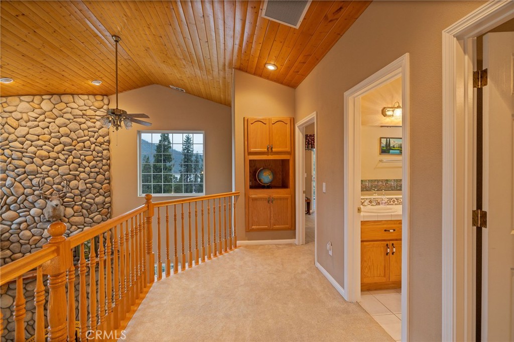 39818 Granite Ridge Lane Bass Lake, CA 93604 - Photo 27 of 58 upper level guest bathroom, primary suite and two guest bedrooms