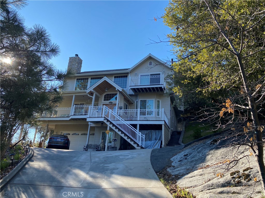 39818 Granite Ridge Lane Bass Lake, CA 93604 - Photo 29 of 29 a front view of a house with a yard
