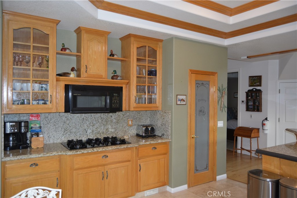39818 Granite Ridge Lane Bass Lake, CA 93604 - Photo 3 of 29 a kitchen with stainless steel appliances granite countertop a stove and a sink
