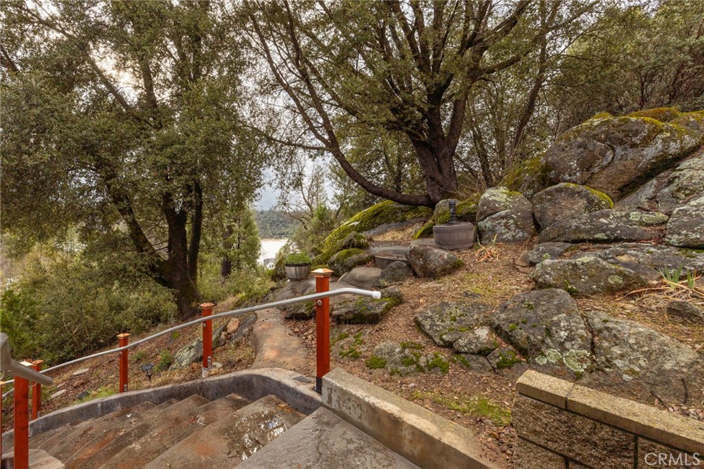 39818 Granite Ridge Lane Bass Lake, CA 93604 - Photo 36 of 58 stairs leading to garage level distant lake views