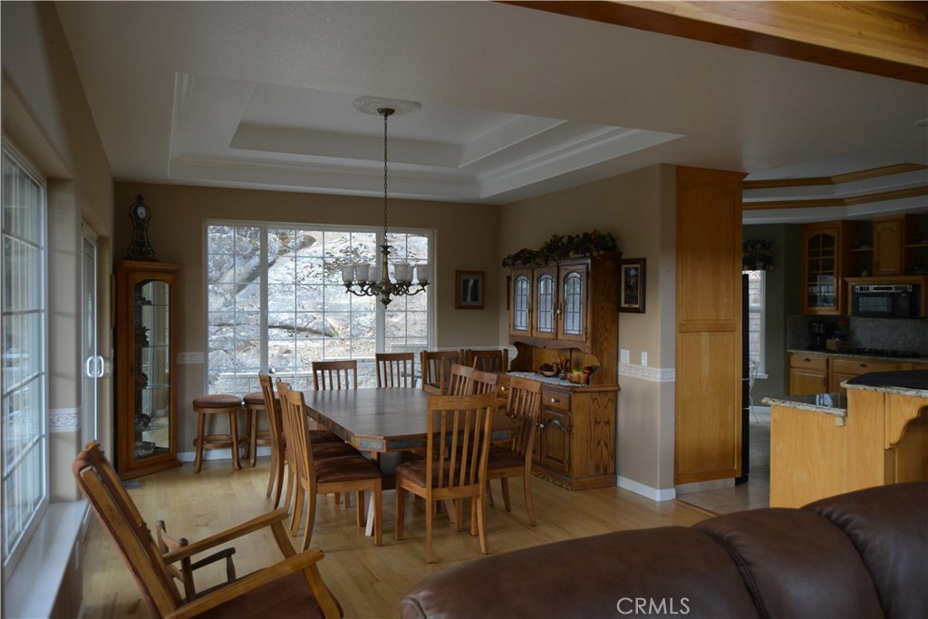 39818 Granite Ridge Lane Bass Lake, CA 93604 - Photo 6 of 29 a view of a dining room with furniture window and outside view
