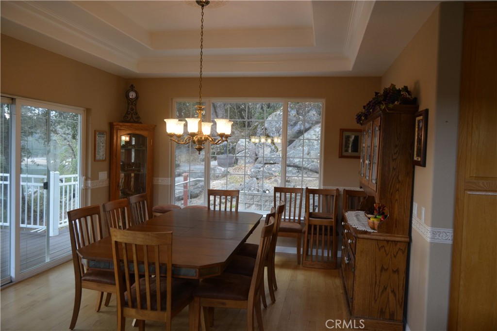 39818 Granite Ridge Lane Bass Lake, CA 93604 - Photo 7 of 29 a view of a dining room with furniture window and outside view