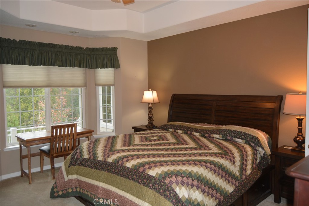 39818 Granite Ridge Lane Bass Lake, CA 93604 - Photo 9 of 29 a bedroom with a bed and a window