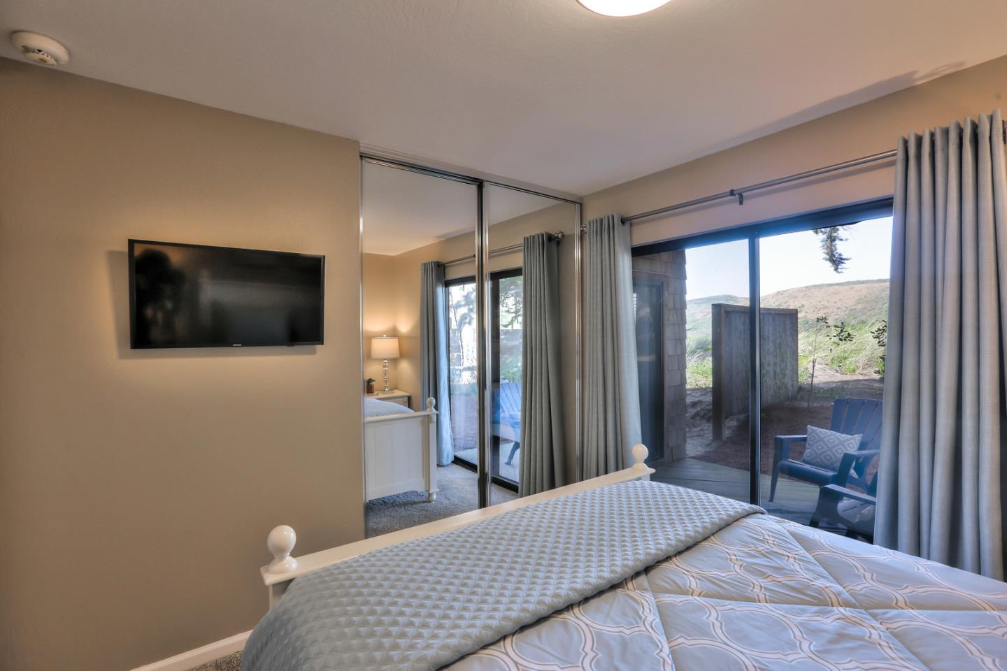 101 Shell Road, Unit 285 Watsonville, CA 95076 - Photo 11 of 27 a bedroom with a bed and a flat screen tv