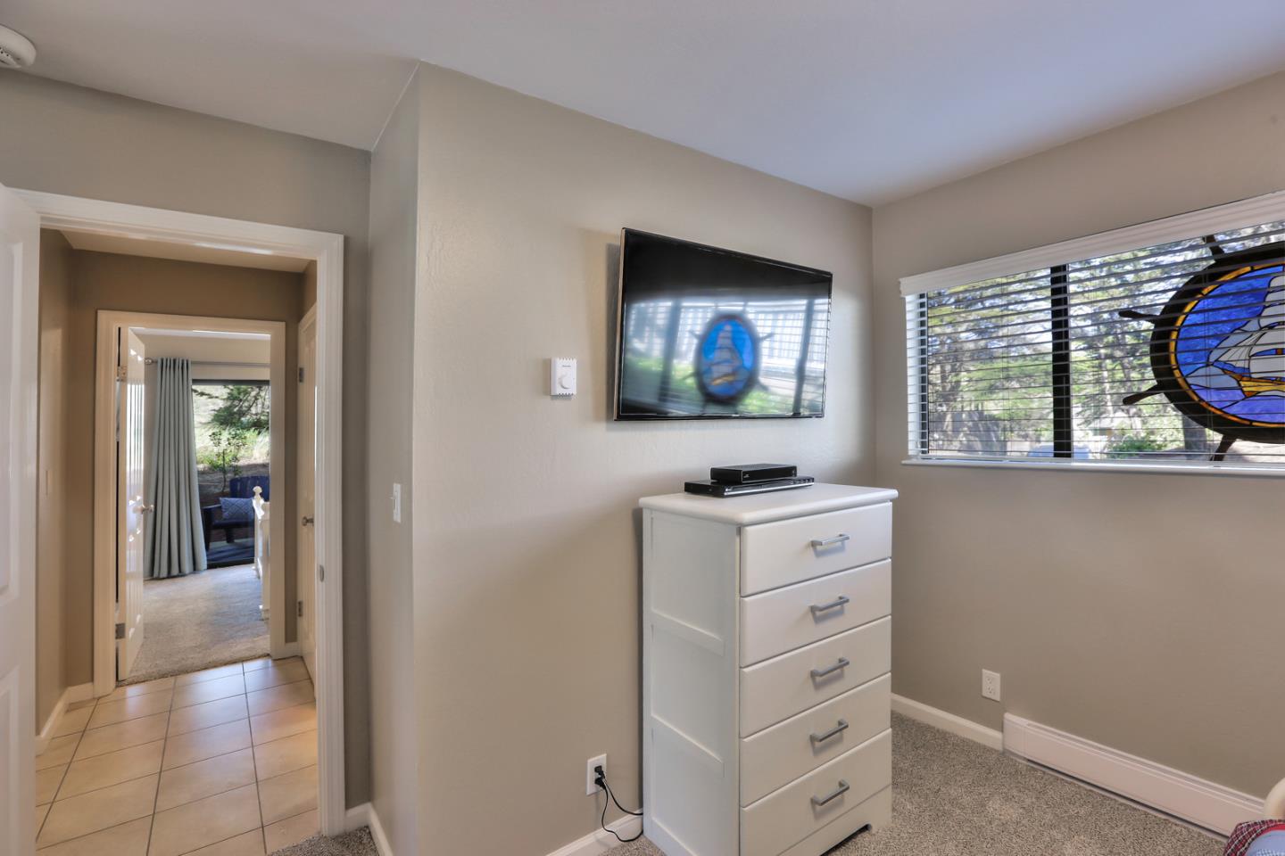 101 Shell Road, Unit 285 Watsonville, CA 95076 - Photo 13 of 27 a living room with window and flat screen tv