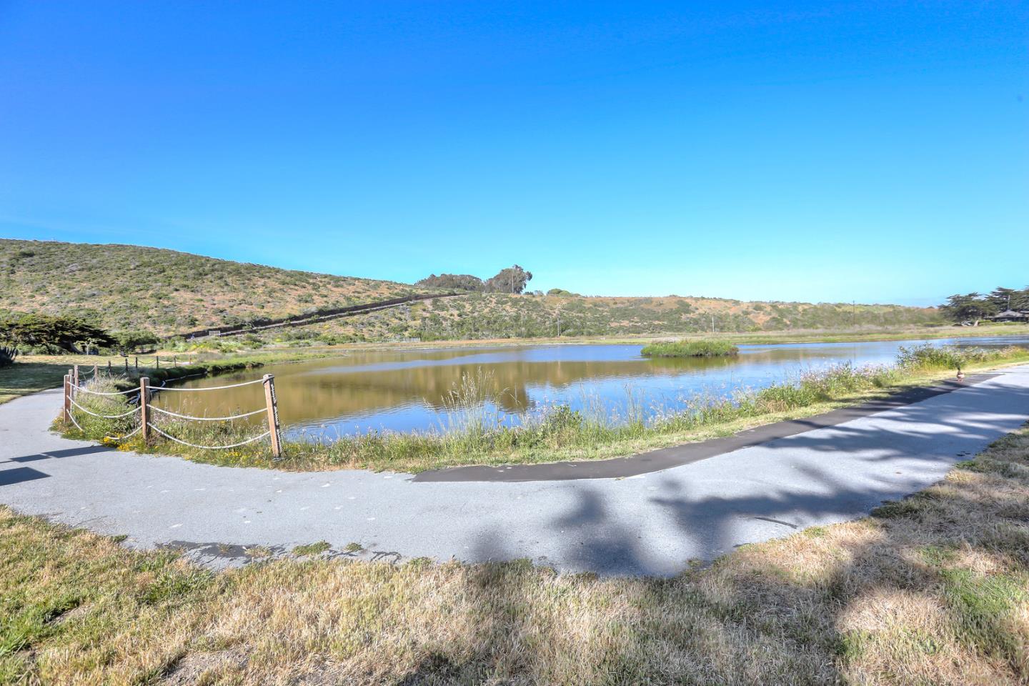 101 Shell Road, Unit 285 Watsonville, CA 95076 - Photo 23 of 27 a view of a lake with a mountain in the background