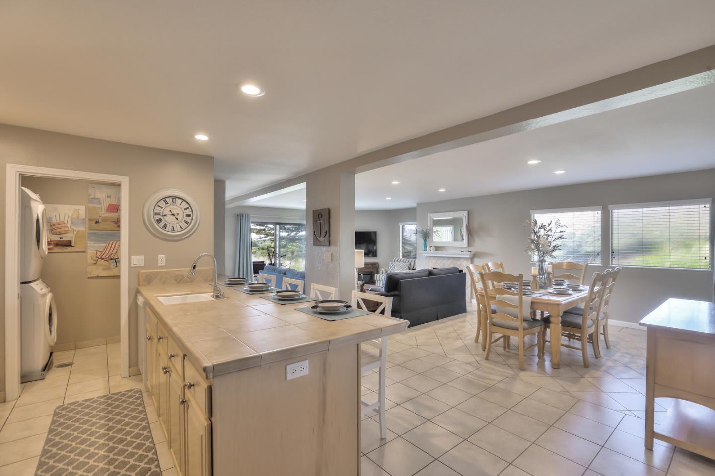 101 Shell Road, Unit 285 Watsonville, CA 95076 - Photo 4 of 27 a dining hall with stainless steel appliances granite countertop a sink a stove a dining table and chairs