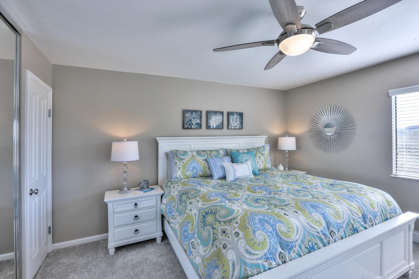 101 Shell Road, Unit 285 Watsonville, CA 95076 - Photo 8 of 27 a bedroom with a bed and a chandelier